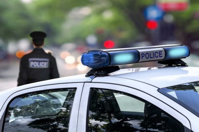 Police,Officer,Emergency,Service,Car,Driving,Street,With,Siren,Light