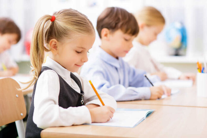 Collective,Work.,Little,Pupils,Are,All,Busy,Writing,In,Their