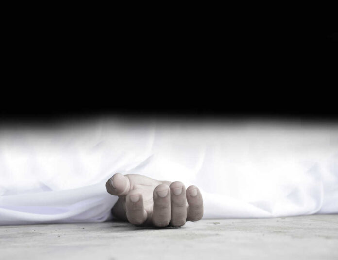 Dead,Body,Laying,On,A,Floor.focus,At,The,Hand