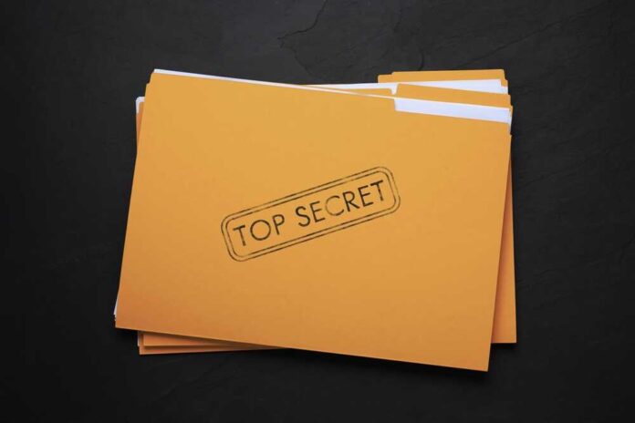 Yellow,File,With,Documents,And,Top,Secret,Stamp,On,Black