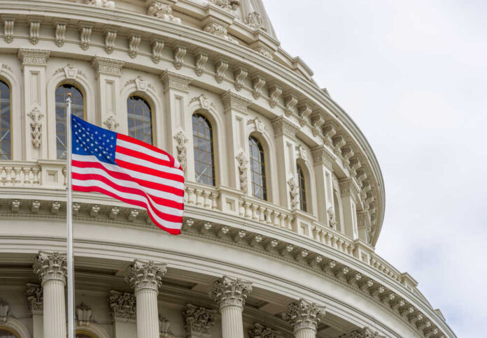 United,States,Capitol,Building,With,Waving,American,Flag,In,Washington