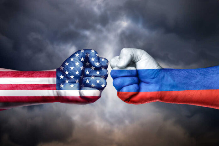 Flags,Of,Usa,And,Russia,Painted,On,Two,Fists,On