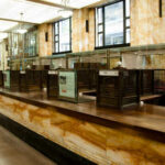 Swiss Bank CRUSHED—Funneled $100M to Iran Interior of a historic bank with marble walls and empty counters