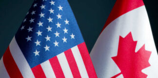 American and Canadian flags close together