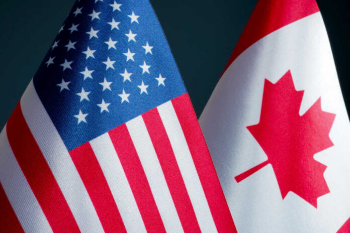American and Canadian flags close together