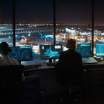 Shocking FAA Oversight: How Staffing Failures Risk Lives Air traffic controllers working at night airport tower