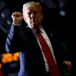 Trump’s Blunt Dismissal: Top Terror Chief Quits man in red tie