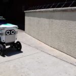 Public Safety at Risk: Robot Crashes Continue A delivery robot navigating a sidewalk in an urban area