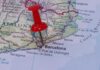 A red pushpin marking Barcelona on a map of Catalonia