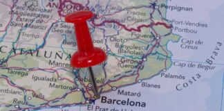 A red pushpin marking Barcelona on a map of Catalonia