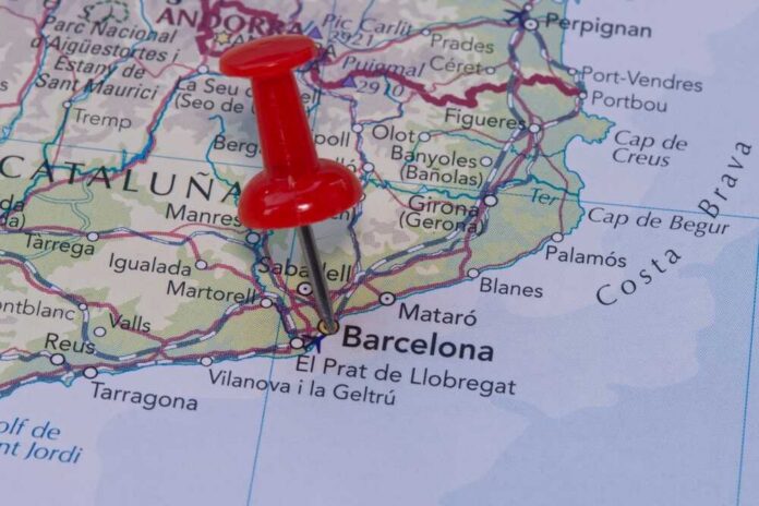 A red pushpin marking Barcelona on a map of Catalonia