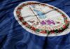 Virginia Dems Defy SCOTUS on Race Quotas Virginia state flag with a blue background and money texture