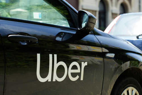 Black car with Uber logo on side door