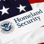 DHS Rechecks 200,000 Afghans—Why Now? Homeland Security sign on American flag background