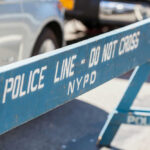 Blue NYPD barricade with Police Line - Do Not Cross.
