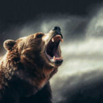 Roaring bear with open mouth against cloudy sky