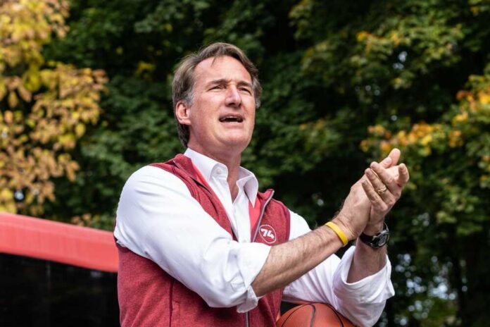 shutterstock_2220823805.jpg Person speaking outdoors while holding a basketball