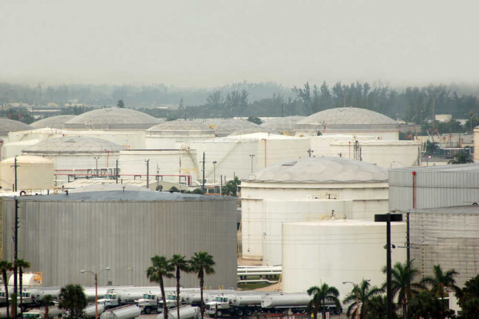 A view of large industrial fuel storage tanks in an urban area
