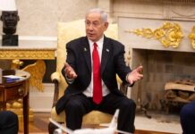 A government official in a suit discussing in a formal setting