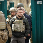 Group of soldiers, including Volodymyr Zelenskyy, wearing tactical gear.