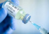 COVID-19 vaccine vial and syringe.