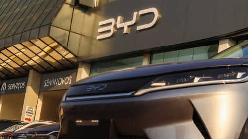 byd2512650637 Car dealership with BYD logo and vehicles displayed