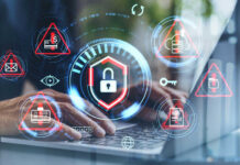 Hands typing with cybersecurity icons overlayed