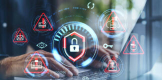 Hands typing with cybersecurity icons overlayed