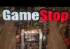 GameStop store sign above crowded retail space