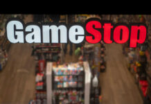 GameStop store sign above crowded retail space