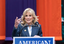 Woman speaking at a podium with microphone