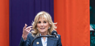 Woman speaking at a podium with microphone