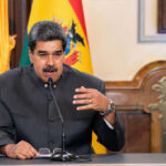 Maduro’s Ally EXTRADITED—DOJ Corruption Bombshell! Man speaking at a podium with microphone