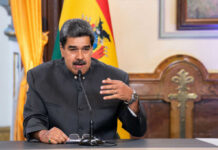 Maduro’s Ally EXTRADITED—DOJ Corruption Bombshell! Man speaking at a podium with microphone