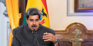 Man speaking at a podium with microphone