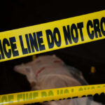 Explosive-Packed Car CRASHES Into Elite Portland Club Police tape with indistinct body underneath in shadowed area