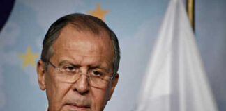 Man in suit with Russian flag backdrop