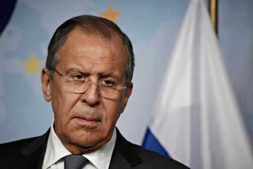 sergei-lavrov1042784230 Man in suit with Russian flag backdrop