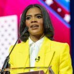 Owens’ Bold Claims Ignite MAGA Infighting A woman in a yellow blazer speaking at a podium with a microphone