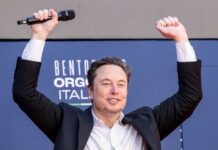 SpaceX IPO Shocker: Musk’s Pay Tied to Mars Person with a microphone raising hands in celebration