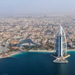 UAE’s $55B Oil Play: Global Energy Shake-Up! Aerial view of Dubai featuring the Burj Al Arab and surrounding buildings
