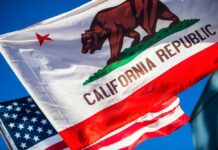 $1 TRILLION Wealth Exodus — California Panics California Republic flag waving alongside the American flag against a blue sky