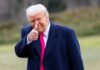 TRUMP Allies With Brazil: Washington’s New Power Shift A man in a dark coat and pink tie giving a thumbs up outdoors