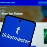 Congress Takes Aim at Ticketmaster Monopoly Mobile phone displaying the Ticketmaster app with event details in the background