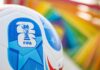 World Cup Fans Dragged Into Surveillance Net? Close-up of a FIFA World Cup soccer ball with a colorful background