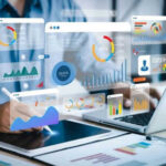 Person analyzing data on tablet and laptop.