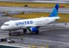 United Airlines Airbus A319 taxiing on a wet airport tarmac