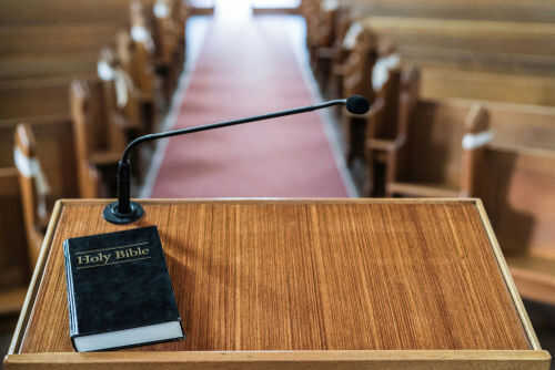 bishop-sunday-service1516915511 Bible and microphone on a church pulpit