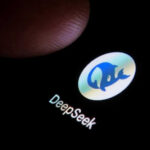 DeepSeek’s $50B Leap Sparks U.S. Fury Finger touching phone screen showing DeepSeek logo