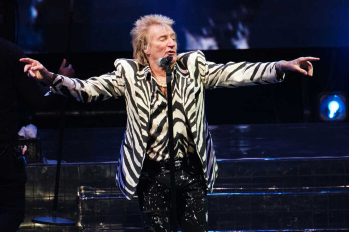od-stewart-performing2400914409jpg Man performing on stage wearing zebra-print outfit